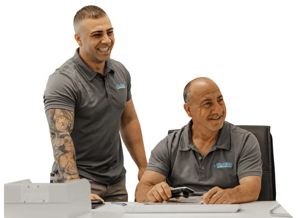 Chris Provenzale, founder of Dr Leak Plumbing, with his father in the company office